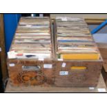 Two vintage bottle crates containing 45 rpm record