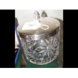 A silver lidded cut glass biscuit barrel by A E Jo