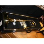 A trombone in fitted carrying case (lacking mouthp