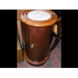 A Victorian mahogany circular pot cupboard with in