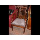 A Chippendale style armchair with carved back and