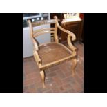 Painted antique armchair with cane work seat