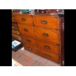 An antique campaign chest in two sections - having