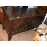 An antique panelled coffer - 134cm