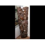 A floor standing carved oriental figure - 100cm hi