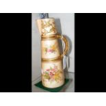 A Royal Worcester jug with hand painted floral dec