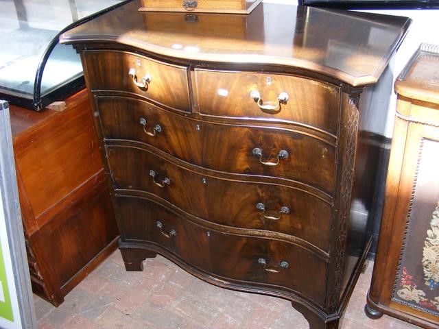 Antique style mahogany serpentine fronted chest of