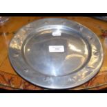 A 24cm diameter Tudric pewter plate with raised de