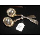 A pair of silver ladles