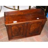 A small antique two door wall cupboard