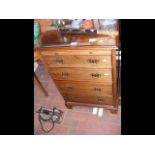 A four drawer chest with brushing slide - 58cm wid