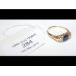 Sapphire and diamond ring in gold setting