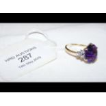 An 18ct gold amethyst and diamond ring