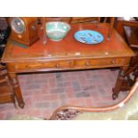 A Victorian two drawer library desk on reeded supp