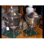 A pair of antique silver plated coolers with lids and