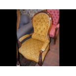 A Victorian armchair on cabriole supports