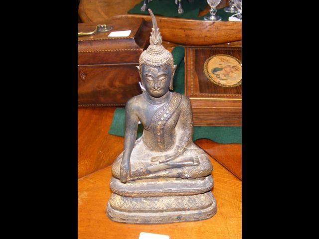 An antique South East Asian bronze Buddha - 27cm h