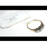 A three stone diamond ring in 18ct gold setting