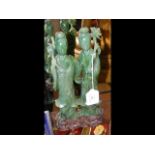 Carved jade figures on wooden stand - 26cm high