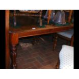 A 19th century mahogany extending dining table on