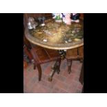 A Victorian oval papier mache tripod table with ha
