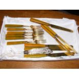 A set of silver gilt fruit knives and forks, etc.