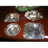 A silver ashtray, together with three others