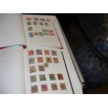 Two albums containing British Commonwealth stamps