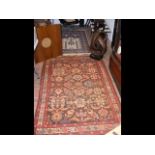 A Middle Eastern style rug with red ground - 194cm