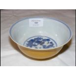 A Chinese yellow bowl, the inside painted with gol