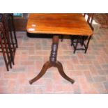 A Regency mahogany snap-top table