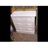 A painted three drawer pine chest