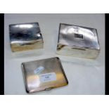 Two silver cigarette boxes, together with a silver