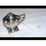 A silver mustard pot with blue glass liner and Lon