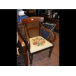 Antique carver chair with curved backrest