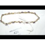 A lady's 9ct gold amethyst mounted bracelet