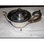 A silver teapot with Birmingham hallmark