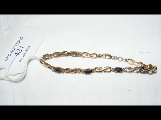 A lady's 9ct gold sapphire mounted bracelet