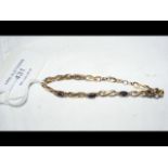 A lady's 9ct gold sapphire mounted bracelet