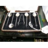 A set of six silver coffee spoons, with sugar tong