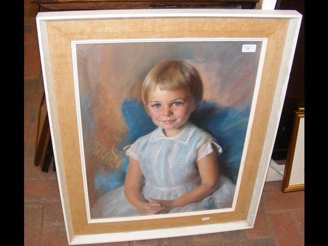 A pastel drawing of child in chair - signed lower