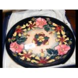 A Moorcroft pottery plate in presentation box - 26