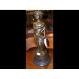 A bronze style figure on marble plinth - 36cm high