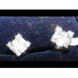 A pair of diamond cluster stud earrings in 18ct wh