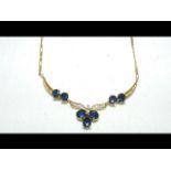 A sapphire and diamond pendant on 18ct gold chain