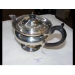 A silver teapot with Chester hallmark