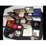 A quantity of cased commemorative medals and medal