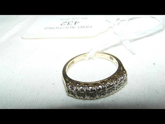 A multi diamond ring in 9ct gold setting