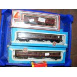 Four boxed Airfix coaches, together with two other