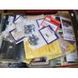 A box of railway accessories